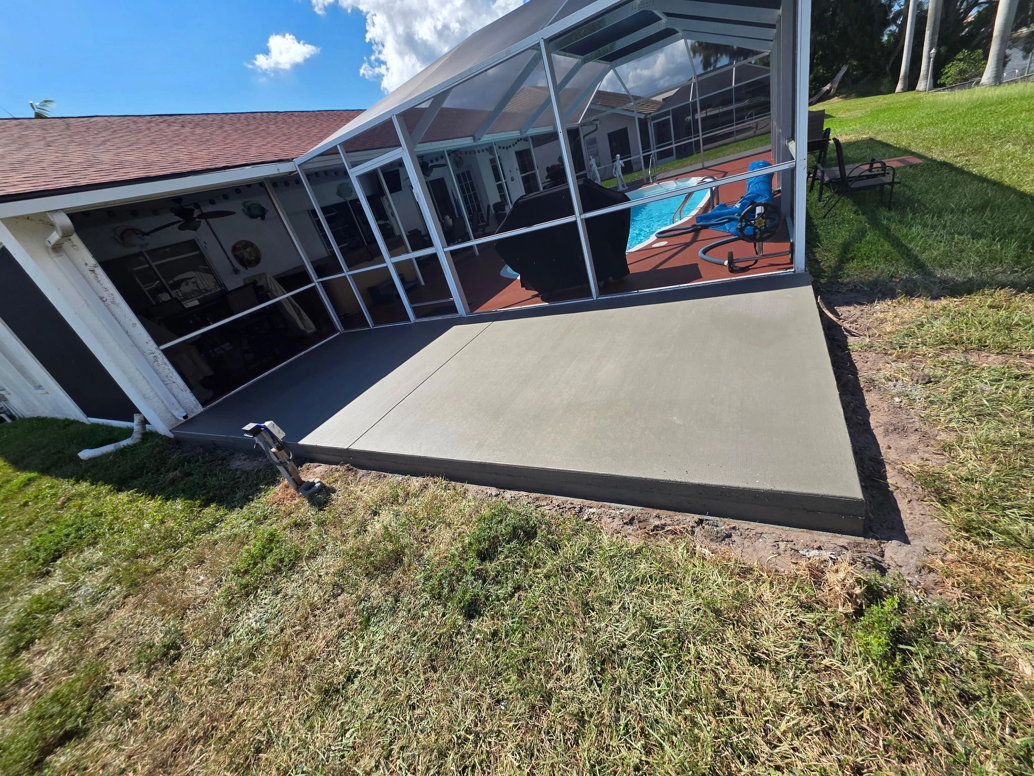 Pool enclosure with concrete deck